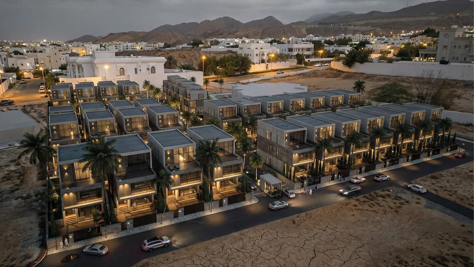 Aerial view of the Al Ilam Heights villas at dusk